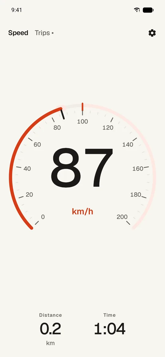 The drive view: a large dial reading 87 km/h, with distance and time
